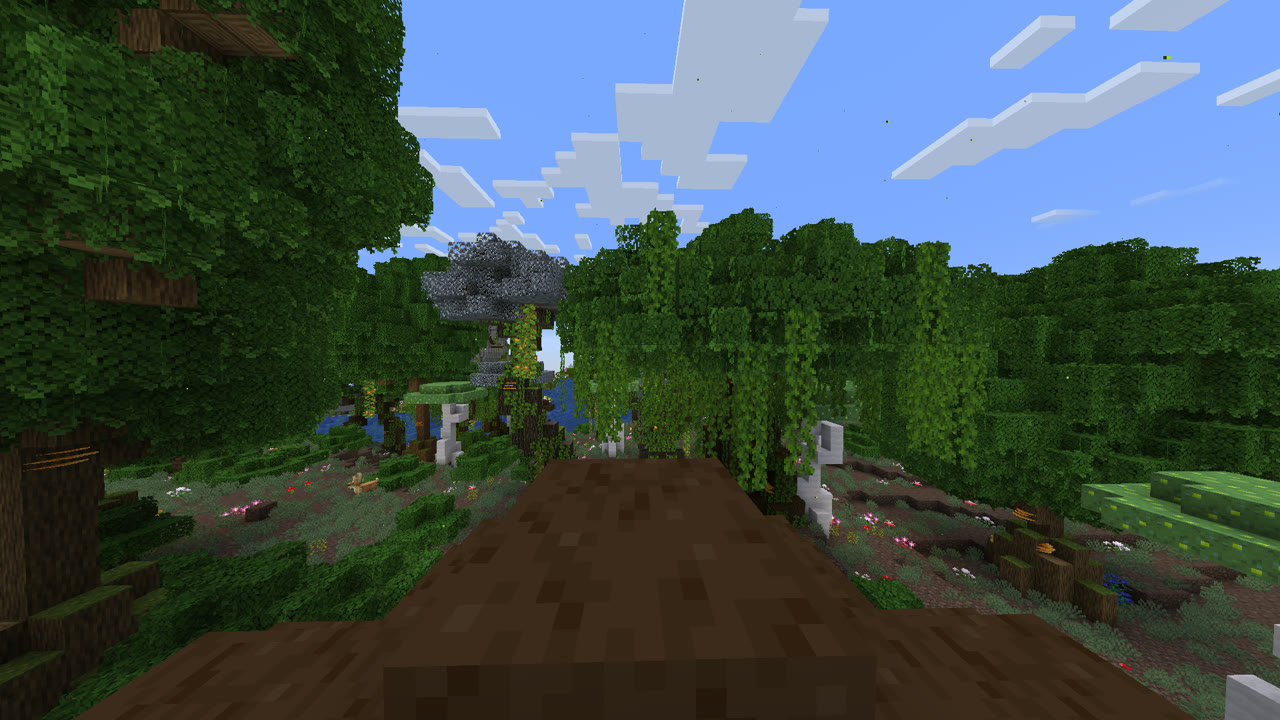 Captura dentro del juego: un camino de tierra se adentra en una selva espesa, con lianas y un cartel de piedra al fondo